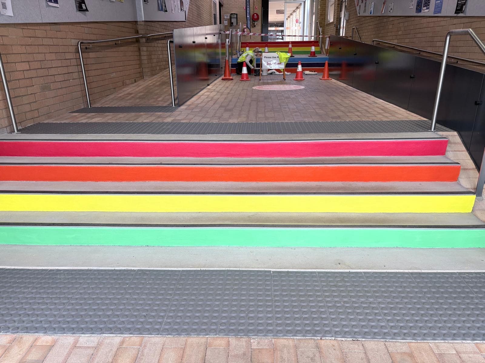Freshly painted stair nosings coned off on a live university campus in Orange NSW