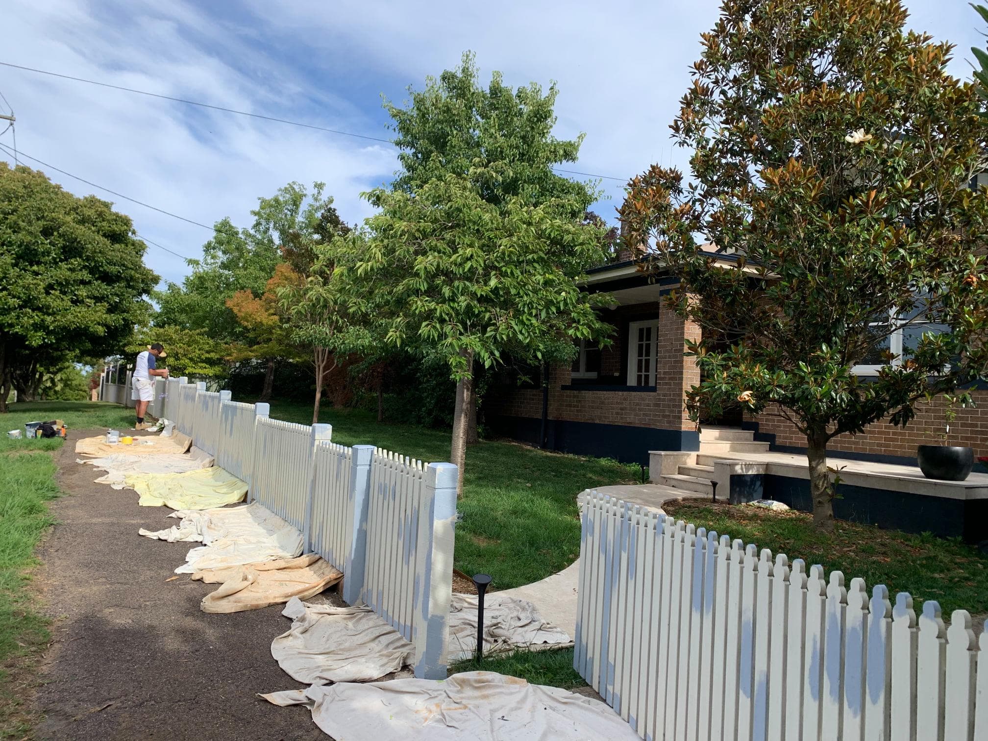 Picket fence painting in progress
