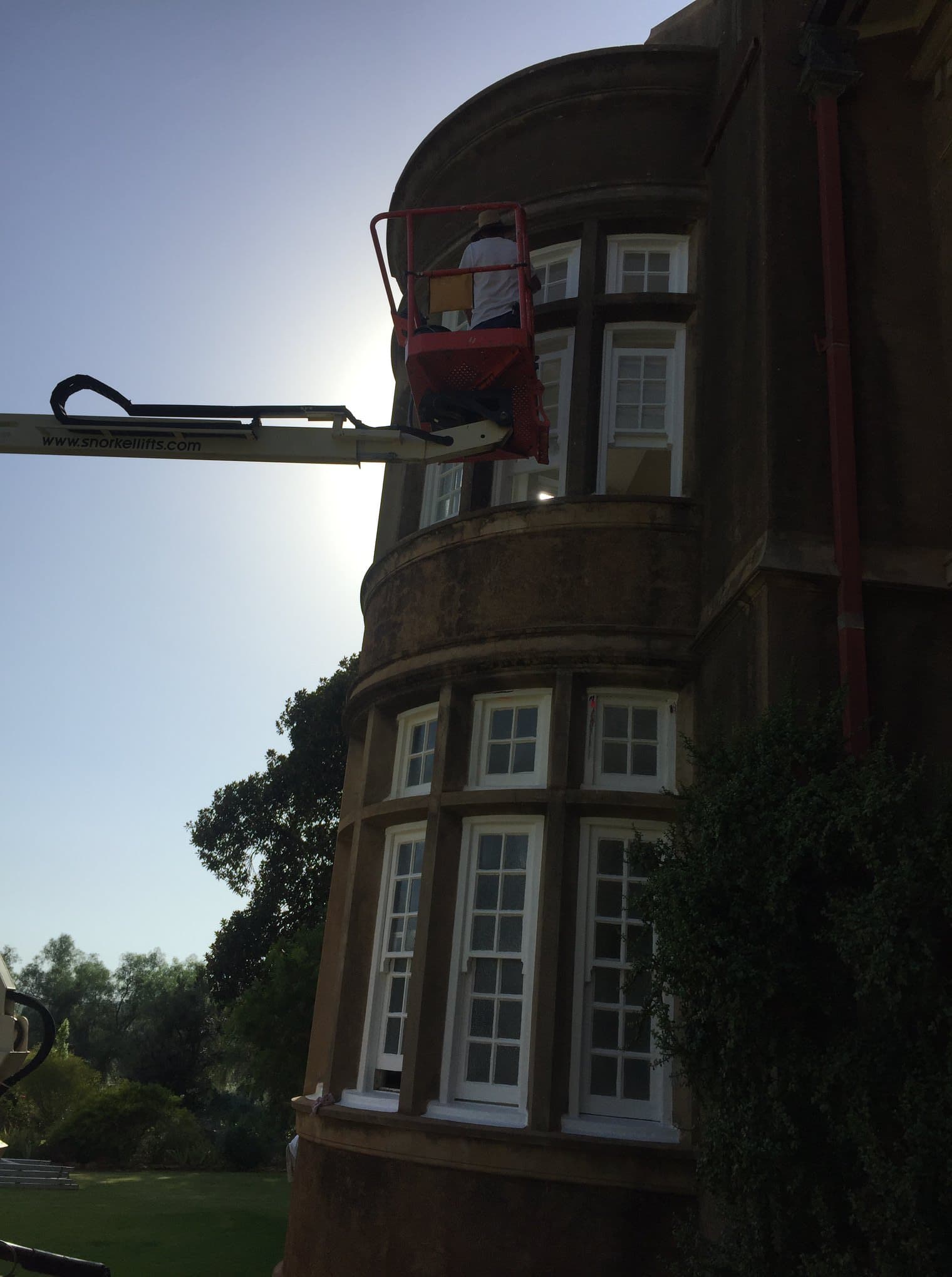 Heritage mansion painting from cherry picker