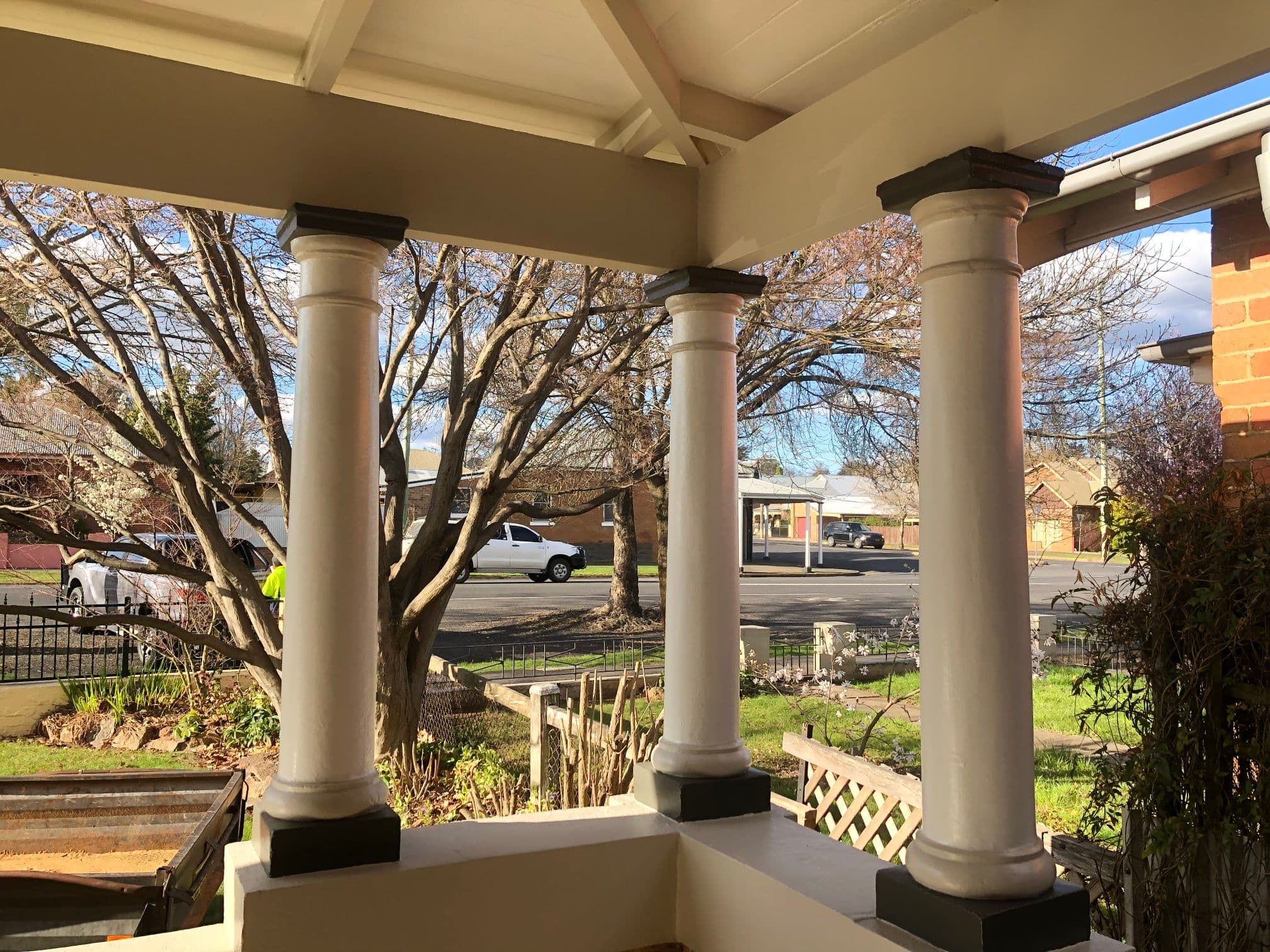 Heritage verandah columns freshly painted in white with dark trim, Orange NSW
