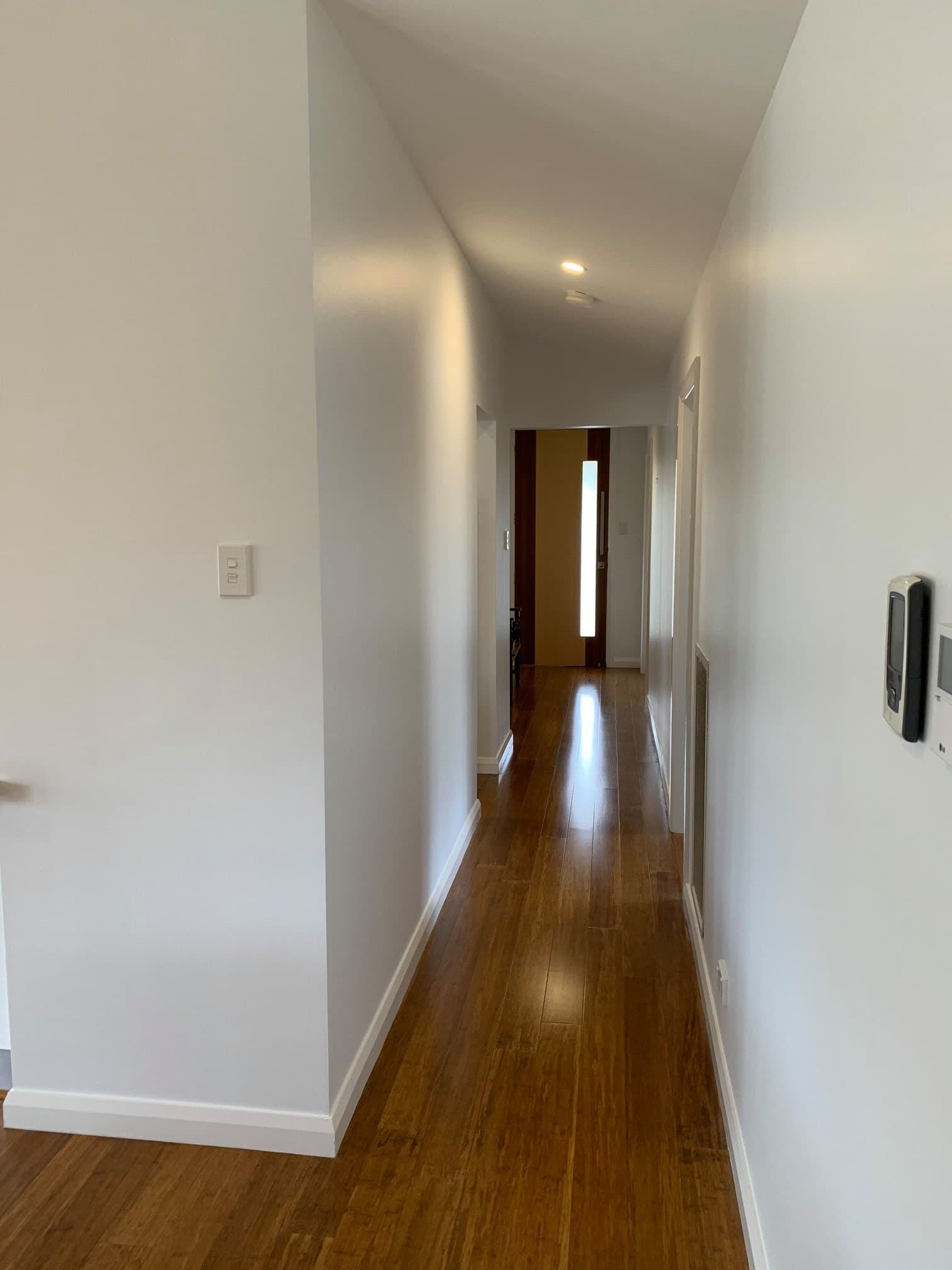 Hallway with raked ceiling