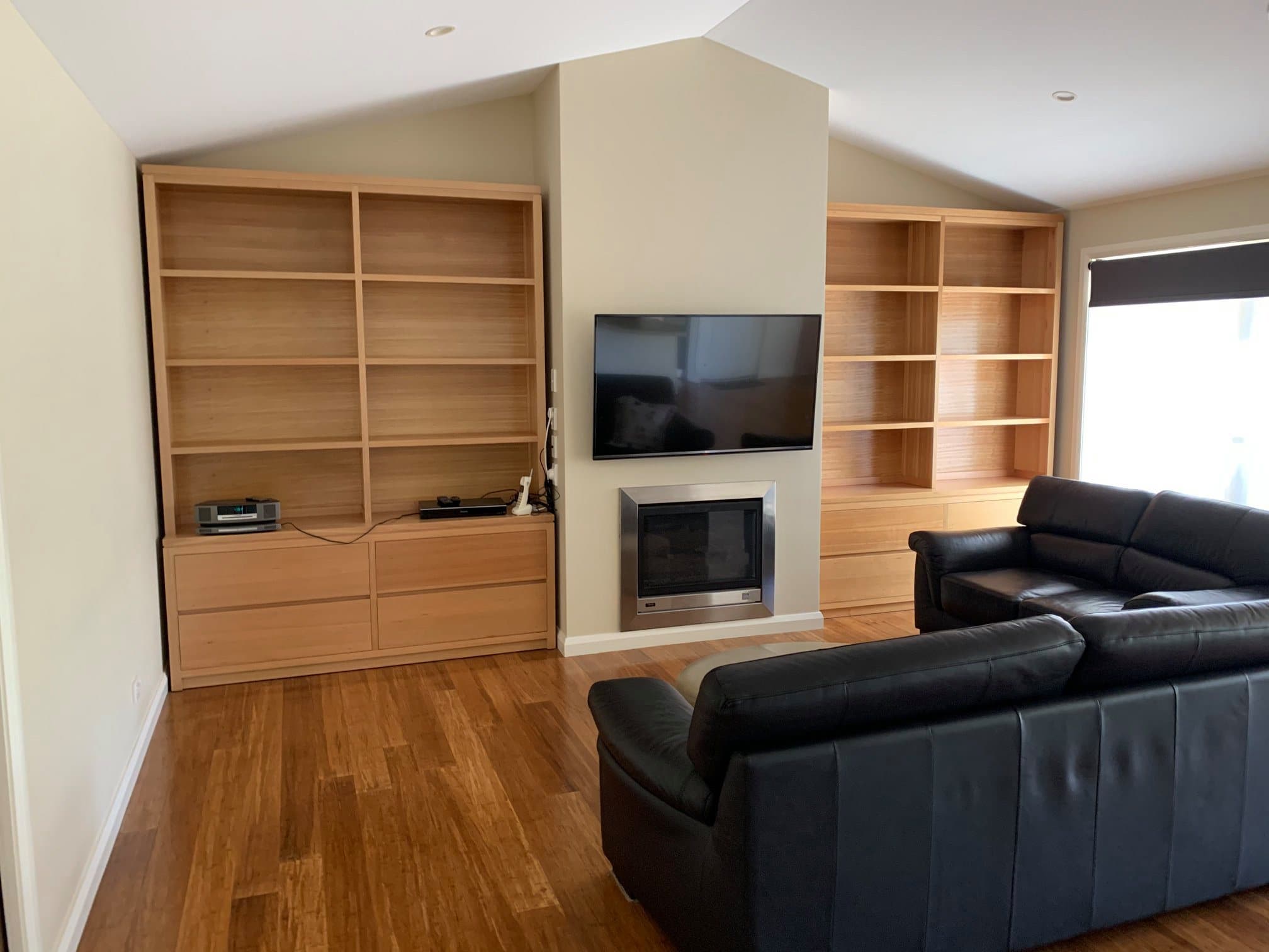 Living room with built-in shelving and freshly painted walls by Murrays Painting, Central West NSW