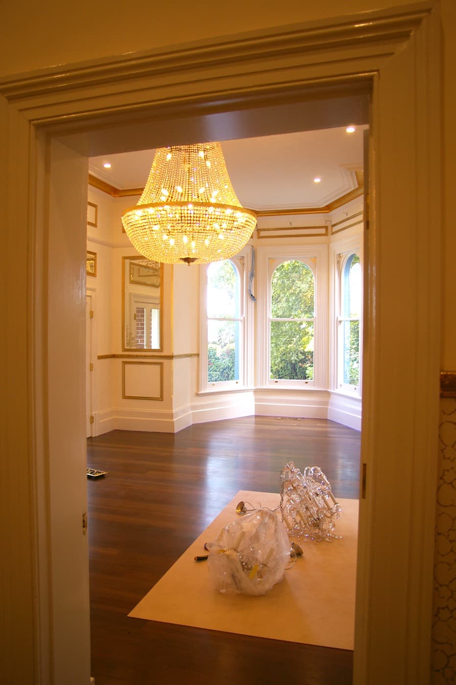 Heritage room with chandelier and bay windows