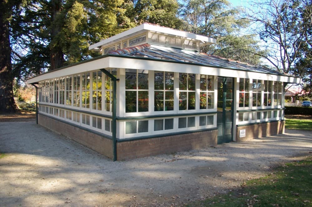 Conservatory glasshouse green and white trim