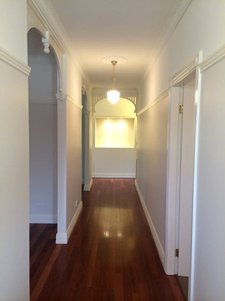 Heritage hallway with archway and polished floors