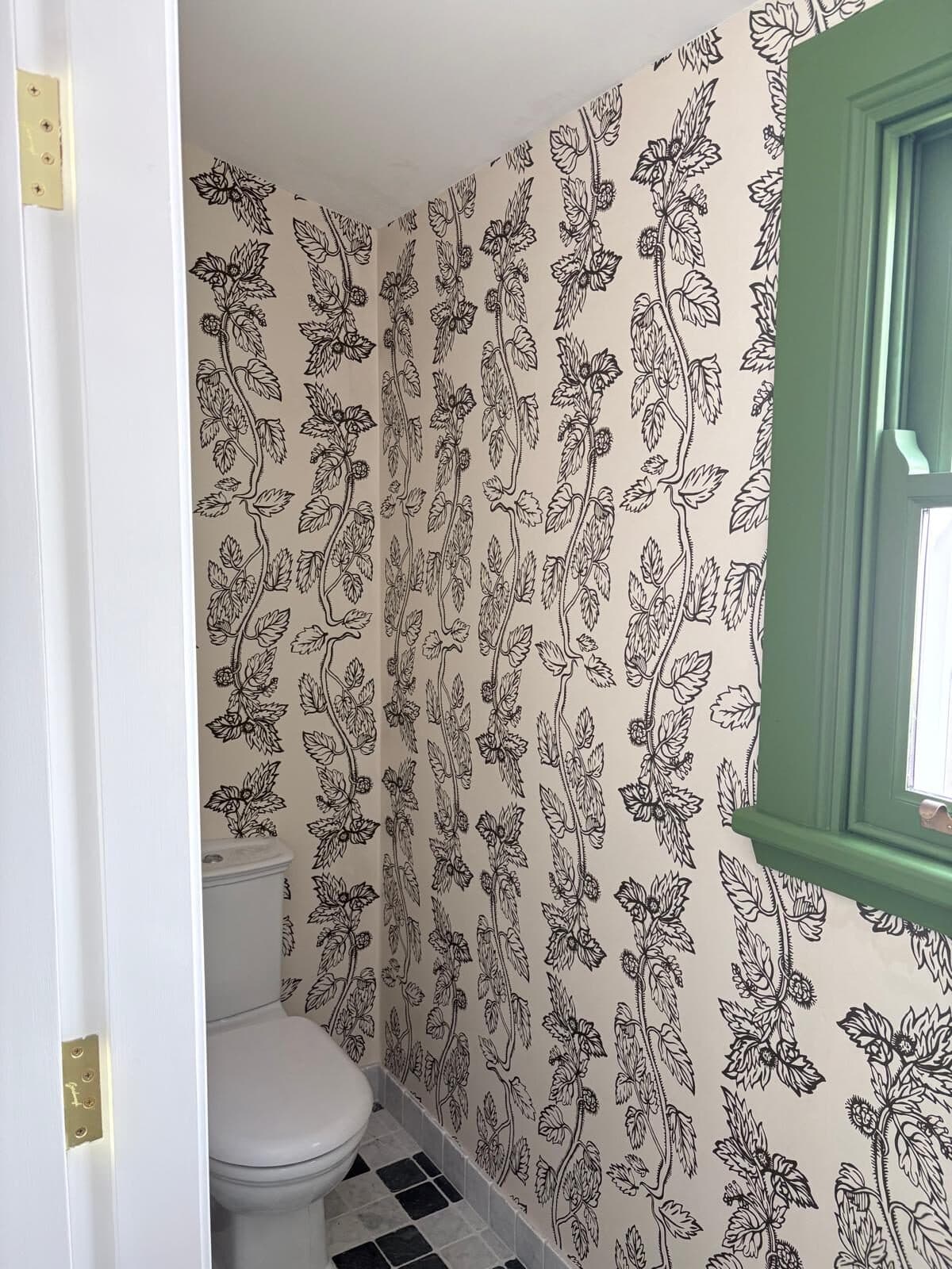 Botanical wallpaper carried around the internal corner of a small powder room with the trailing pattern matched across the join, Central West NSW